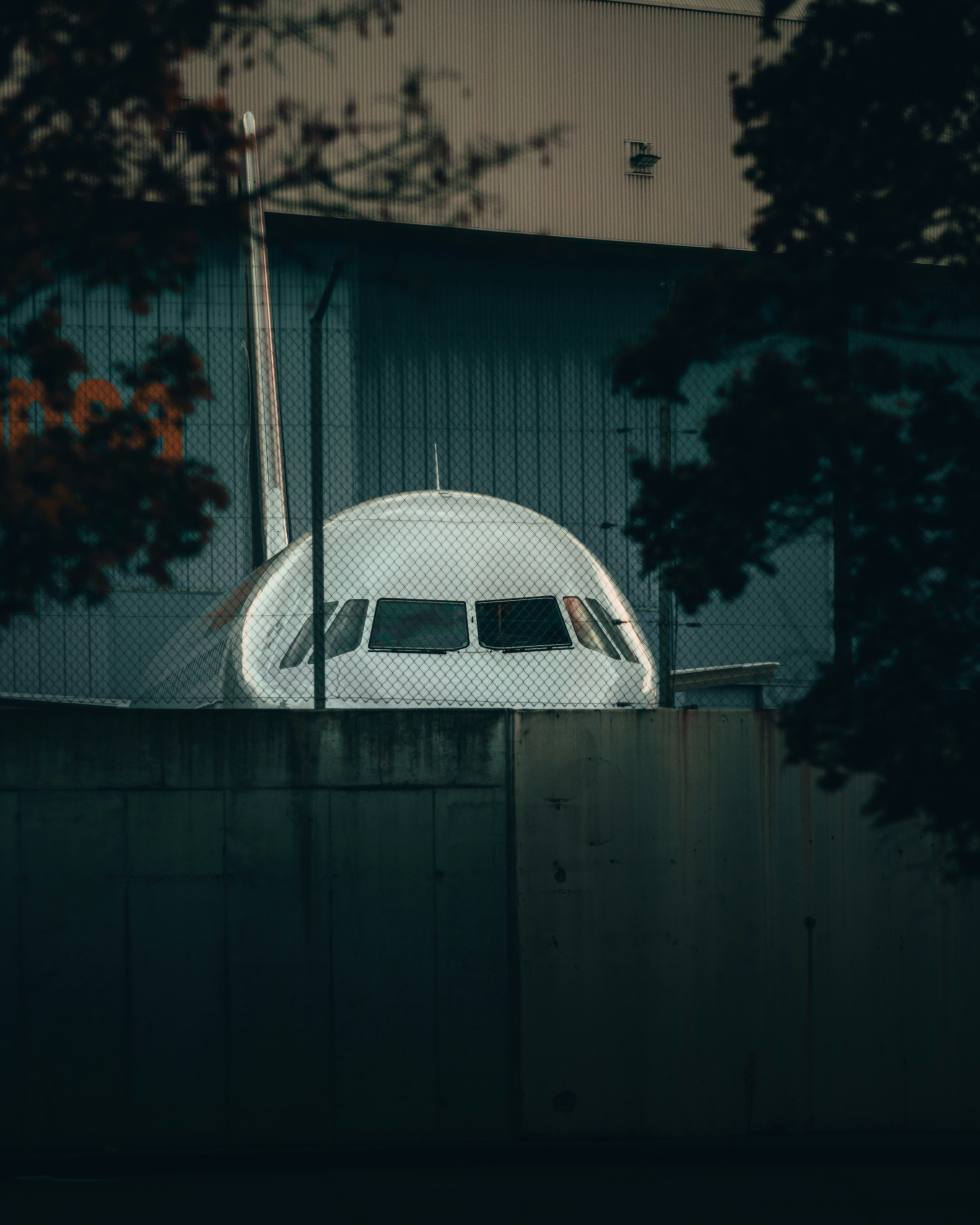 an airplane is parked in front of a building
